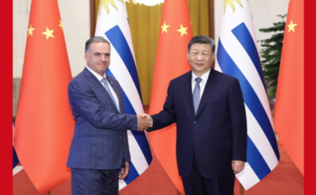 厕所偷拍同乌拉圭总统奥尔西举行会谈